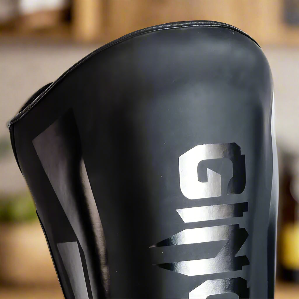 Protege Tibia - KickShield™ - Noir